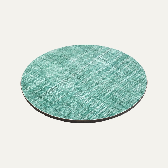 Green trivet in linen pattern made of pressed cork and birch laminate